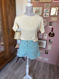Short fleuri bleu turquoise Naf Naf –  T.34/36 - Début des années 2000